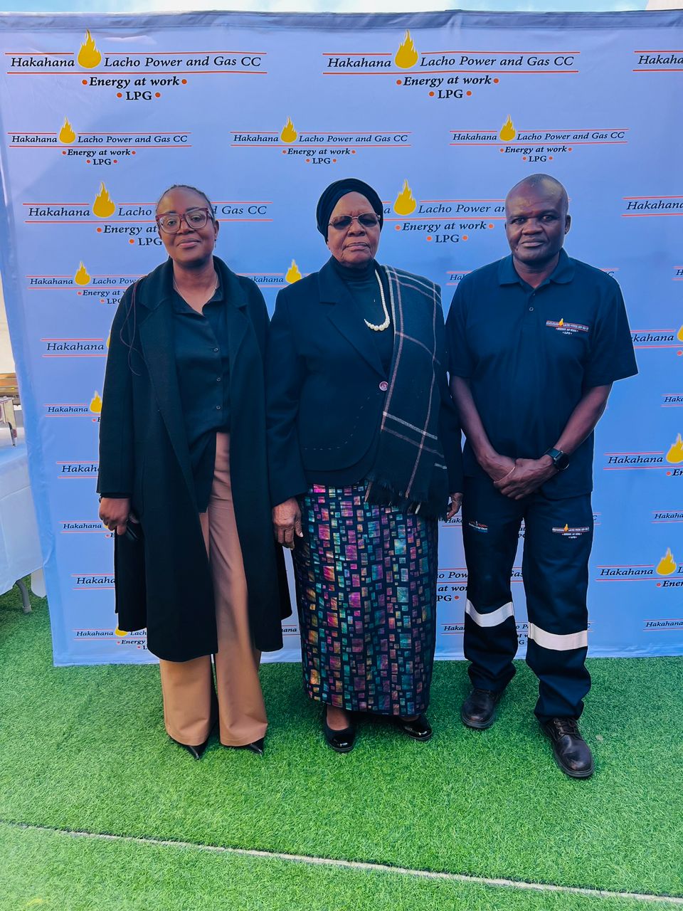 Three people posed at the branch opening event